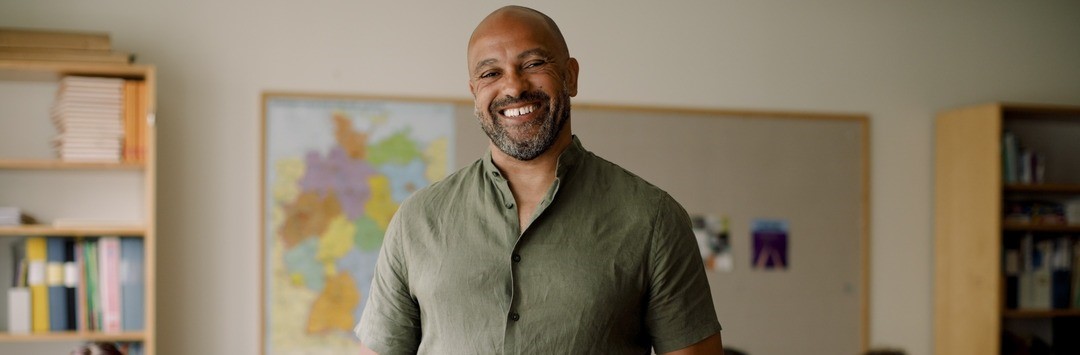 Smiling man in a classroom